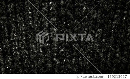 black wool knit texture macro view fibrous strands subtle sheen cozy dark abstract background 139213637