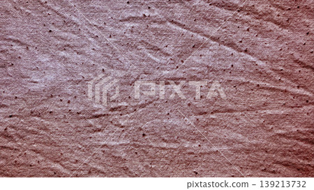 reddish brown burlap fabric texture closeup revealing intricate weaves gentle wrinkles and scattered dark flecks evoking rustic organic elegance for design inspiration 139213732