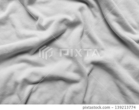 wrinkled gray fabric texture closeup soft folds minimalist abstract background serene material detail tactile surface calm neutral tone 139213774