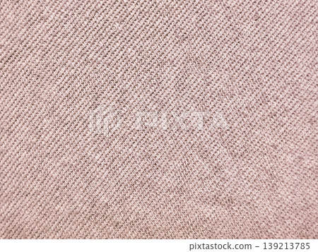 soft beige knit fabric texture closeup radiating cozy warmth with intricate weave patterns in neutral earthy tones soft beige knit fabric texture closeup radiating cozy warmth with intricate weave patterns in neutral earthy tones 139213785