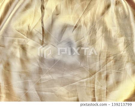 crumpled golden satin fabric texture shimmering with elegant folds and lustrous creases in macro closeup crumpled golden satin fabric texture shimmering with elegant folds and lustrous creases in macro closeup 139213799