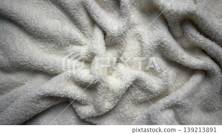 soft white fluffy towel texture closeup with gentle folds and luxurious waves evoking cozy spa serenity soft white fluffy towel texture closeup with gentle folds and luxurious waves evoking cozy spa serenity 139213891