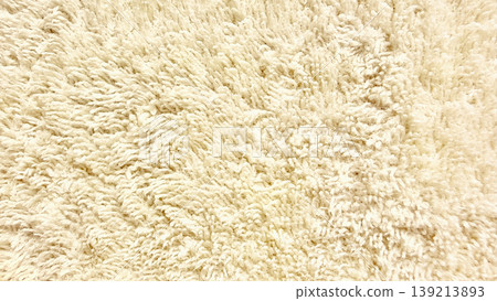 creamy beige shag carpet closeup fluffy soft fibers inviting warmth cozy home interior texture background 139213893