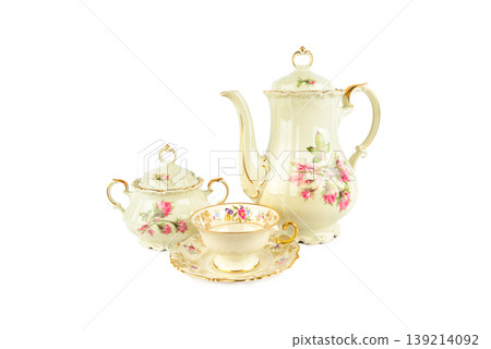 Vintage Porcelain Tea Set with Floral Rose Pattern Isolated on White Vintage Porcelain Tea Set with Floral Rose Pattern Isolated on White 139214092