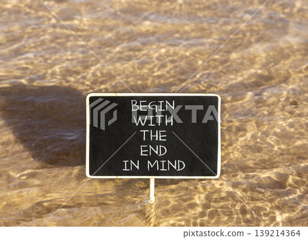 Begin with the end in mind symbol. Concept words Begin with the end in mind on beautiful black blackboard. Beautiful sea water background. Business begin with the end in mind concept. Copy space. Begin with the end in mind symbol. Concept words Begin with the end in mind on beautiful black blackboard. Beautiful sea water background. Business begin with the end in mind concept. Copy space. 139214364