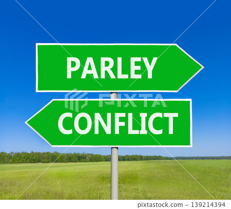 Parley instead conflict symbol. Concept words Parley and Conflict on beautiful green road sign. Beautiful blue sky green grass background. Social and parley instead conflict concept. Copy space. 139214394