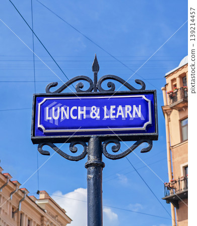 Lunch and learn symbol. Concept words Lunch and learn on beautiful big blue road sign. Beautiful blue sky and buildings background. Business, educational and lunch and learn concept. Copy space. Lunch and learn symbol. Concept words Lunch and learn on beautiful big blue road sign. Beautiful blue sky and buildings background. Business, educational and lunch and learn concept. Copy space. 139214457