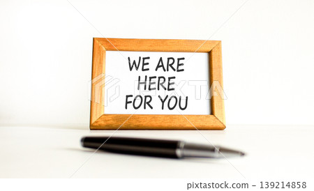 Support, help and we are here for you symbol. Concept words We are here for you on beautiful wooden picture frame. Beautiful white background. Business we are here for you concept. Copy space. Support, help and we are here for you symbol. Concept words We are here for you on beautiful wooden picture frame. Beautiful white background. Business we are here for you concept. Copy space. 139214858