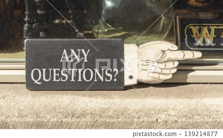 Any questions symbol. Concept words Any questions on beautiful wooden black sign as a hand. Beautiful store display background. Business and Any questions Q and A concept, copy space. Any questions symbol. Concept words Any questions on beautiful wooden black sign as a hand. Beautiful store display background. Business and Any questions Q and A concept, copy space. 139214877