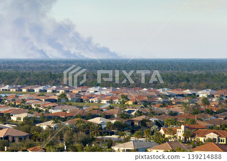 Suburban neighborhood in Florida suffering from bad air quality polluted with prescribed forest fire smoke Suburban neighborhood in Florida suffering from bad air quality polluted with prescribed forest fire smoke 139214888
