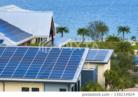 Solar photovoltaic panels installed on top of Florida office building for producing clean ecological electric energy. Renewable electricity with zero emission concept 139214924