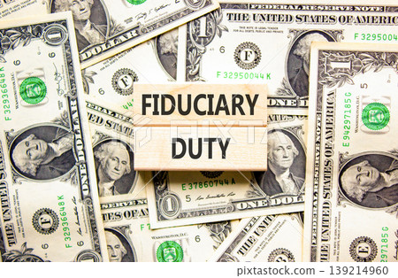 Fiduciary duty words symbol. Concept words Fiduciary duty on beautiful wooden blocks. Beautiful dollar bills background. Dollar bills. Business and Fiduciary duty words concept. Copy space. Fiduciary duty words symbol. Concept words Fiduciary duty on beautiful wooden blocks. Beautiful dollar bills background. Dollar bills. Business and Fiduciary duty words concept. Copy space. 139214960