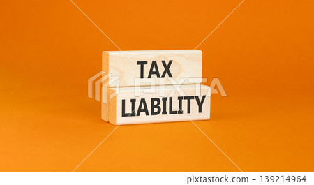 Tax liability words symbol. Concept words Tax liability on beautiful wooden blocks. Beautiful orange background. Business and Tax liability words concept. Copy space. 139214964