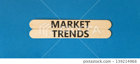Market trends words symbol. Concept words Market trends on beautiful wooden sticks. Beautiful blue background. Business and Market trends words concept. Copy space. 139214968