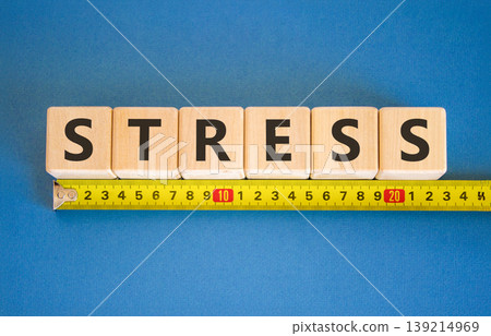 Stress word symbol. Concept word Stress on beautiful wooden blocks. Beautiful blue background. Beautiful yellow tape measure ruler. Business psychological medical stress word concept. Copy space. Stress word symbol. Concept word Stress on beautiful wooden blocks. Beautiful blue background. Beautiful yellow tape measure ruler. Business psychological medical stress word concept. Copy space. 139214969