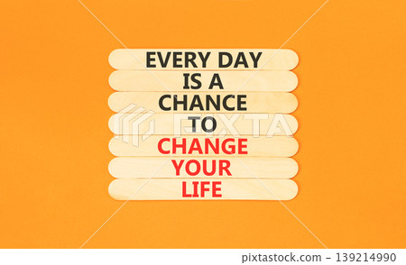 Change your life symbol. Concept words Every day is a chance to change your life on beautiful wooden sticks. Beautiful orange paper background. Business change your life concept. Copy space. Change your life symbol. Concept words Every day is a chance to change your life on beautiful wooden sticks. Beautiful orange paper background. Business change your life concept. Copy space. 139214990