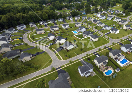 Residential homes in suburban sprawl development in Rochester, New York. Low-density two story private houses in rural suburbs. Housing market in the USA Residential homes in suburban sprawl development in Rochester, New York. Low-density two story private houses in rural suburbs. Housing market in the USA 139215032