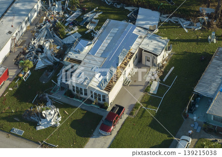 Property damage from strong hurricane winds. Mobile homes in Florida residential area with destroyed rooftops. Consequences of natural disaster Property damage from strong hurricane winds. Mobile homes in Florida residential area with destroyed rooftops. Consequences of natural disaster 139215038