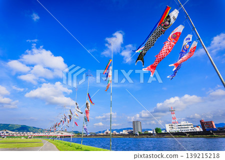 A springtime spectacle: Colorful carp streamers gracefully swimming in the Kawauchi River. A springtime spectacle: Colorful carp streamers gracefully swimming in the Kawauchi River. 139215218