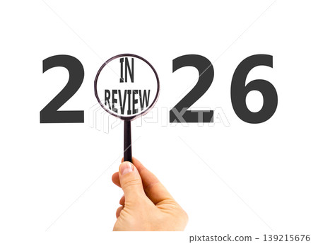 2026 year in review symbol. Concept words 2026 in review in beautiful magnifying glass. Beautiful white background. Businessman's hand. Business 2026 year in review concept. Copy space. 2026 year in review symbol. Concept words 2026 in review in beautiful magnifying glass. Beautiful white background. Businessman's hand. Business 2026 year in review concept. Copy space. 139215676