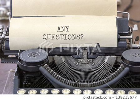 Any questions symbol. Concept words Any questions typed on beautiful old retro typewriter. Beautiful white paper background. Business and Any questions Q and A concept, copy space. Any questions symbol. Concept words Any questions typed on beautiful old retro typewriter. Beautiful white paper background. Business and Any questions Q and A concept, copy space. 139215677
