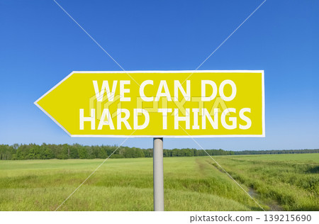 Support, help we can do hard things symbol. Concept words We can do hard things on beautiful yellow road sign. Beautiful blue sky field background. Business we can do hard things concept. Copy space. Support, help we can do hard things symbol. Concept words We can do hard things on beautiful yellow road sign. Beautiful blue sky field background. Business we can do hard things concept. Copy space. 139215690