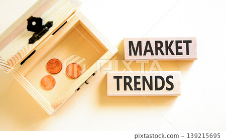 Market trends words symbol. Concept words Market trends on beautiful wooden blocks. Beautiful white background. Wooden chest with coins. Business and Market trends words concept. Copy space. Market trends words symbol. Concept words Market trends on beautiful wooden blocks. Beautiful white background. Wooden chest with coins. Business and Market trends words concept. Copy space. 139215695