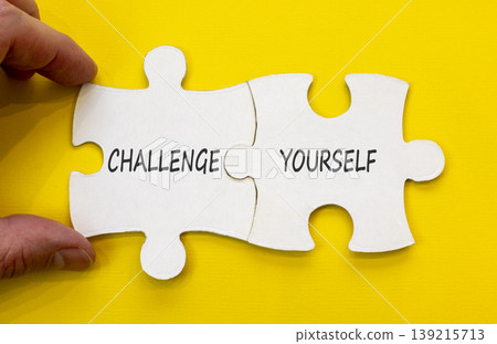 Challenge yourself words symbol. Concept words Challenge yourself on beautiful white puzzles. Beautiful yellow background. Business lifestyle and Challenge yourself words concept. Copy space. 139215713