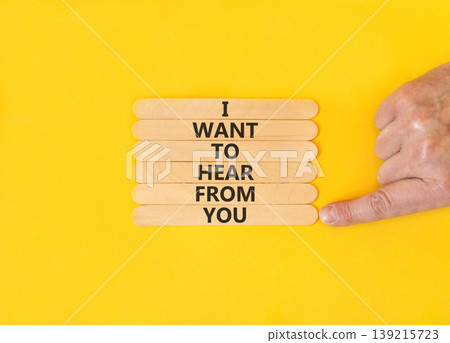 I want to hear from you symbol. Concept words I want to hear from you on beautiful wooden sticks. Beautiful yellow paper background. Business support I want to hear from you concept. Copy space. 139215723