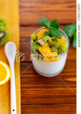 healthy breakfast yogurt with fresh kiwi and orange topping healthy breakfast yogurt with fresh kiwi and orange topping 139215955