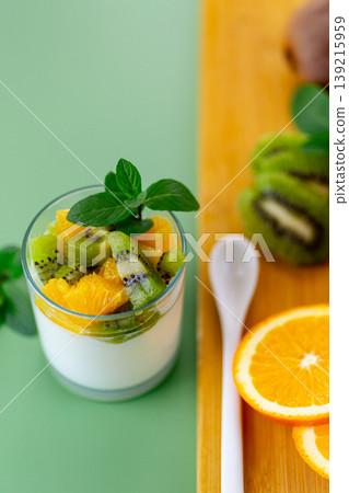 healthy breakfast yogurt with fresh kiwi and orange topping healthy breakfast yogurt with fresh kiwi and orange topping 139215959