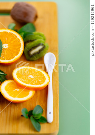 healthy citrus fruit composition with orange kiwi and mint leaves healthy citrus fruit composition with orange kiwi and mint leaves 139215961
