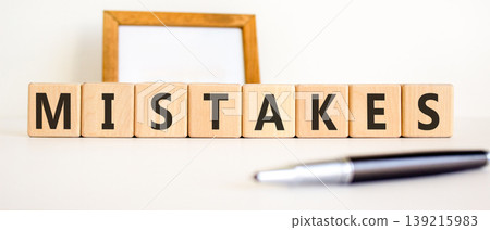 Mistakes mistake word symbol. Concept word Mistakes on beautiful wooden blocks. Beautiful white background. Beautiful black pen. Business support help mistakes mistake word concept. Copy space. Mistakes mistake word symbol. Concept word Mistakes on beautiful wooden blocks. Beautiful white background. Beautiful black pen. Business support help mistakes mistake word concept. Copy space. 139215983
