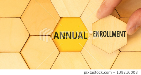 Annual enrollment words symbol. Concept words Annual enrollment on beautiful wooden puzzles. Beautiful yellow background. Doctor hand. Medical and Annual enrollment words concept. Copy space. Annual enrollment words symbol. Concept words Annual enrollment on beautiful wooden puzzles. Beautiful yellow background. Doctor hand. Medical and Annual enrollment words concept. Copy space. 139216008