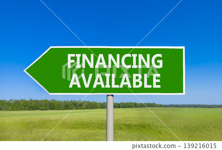 Financing available symbol. Concept words Financing available on beautiful green road sign. Beautiful blue sky green grass field background. Business financing available concept. Copy space. 139216015