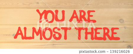 You are almost there words symbol. Concept words You are almost there on beautiful wooden wall. Beautiful wooden wall background. Business You are almost there motivational support concept. Copy space You are almost there words symbol. Concept words You are almost there on beautiful wooden wall. Beautiful wooden wall background. Business You are almost there motivational support concept. Copy space 139216026