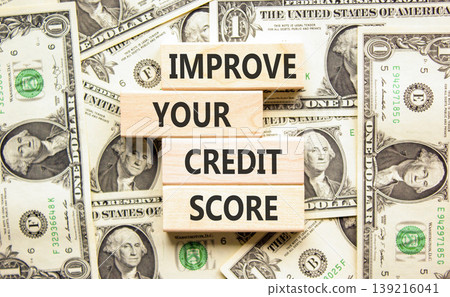Improve your credit score words symbol. Concept words Improve your credit score on beautiful wooden blocks. Beautiful dollar bills background. Business improve your credit score concept. Copy space. Improve your credit score words symbol. Concept words Improve your credit score on beautiful wooden blocks. Beautiful dollar bills background. Business improve your credit score concept. Copy space. 139216041