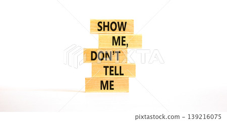 Tell or show symbol. Concept words Show me, do not tell me on beautiful wooden blocks. Beautiful white paper background. Business tell or show concept. Copy space. Tell or show symbol. Concept words Show me, do not tell me on beautiful wooden blocks. Beautiful white paper background. Business tell or show concept. Copy space. 139216075