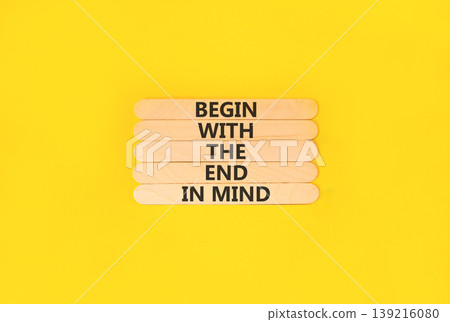 Begin with the end in mind symbol. Concept words Begin with the end in mind on beautiful wooden sticks. Beautiful yellow paper background. Business begin with the end in mind concept. Copy space. Begin with the end in mind symbol. Concept words Begin with the end in mind on beautiful wooden sticks. Beautiful yellow paper background. Business begin with the end in mind concept. Copy space. 139216080