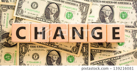 Change symbol. Concept word Change on beautiful wooden blocks. Beautiful dollar bills background. Beautiful dollar bills. Business change concept. Copy space. Change symbol. Concept word Change on beautiful wooden blocks. Beautiful dollar bills background. Beautiful dollar bills. Business change concept. Copy space. 139216081
