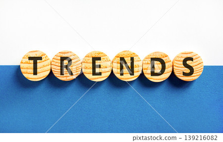 Trends trend word symbol. Concept word Trends on beautiful wooden circles. Beautiful blue and white background. Business trends trend word concept. Copy space. Trends trend word symbol. Concept word Trends on beautiful wooden circles. Beautiful blue and white background. Business trends trend word concept. Copy space. 139216082