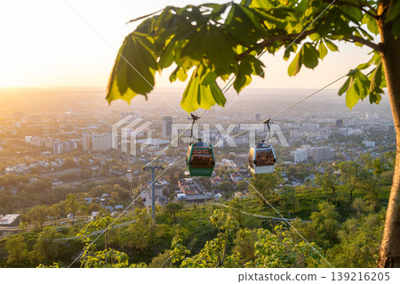 Cable car gondola over Almaty city at colorful sunset with cityscape 139216205