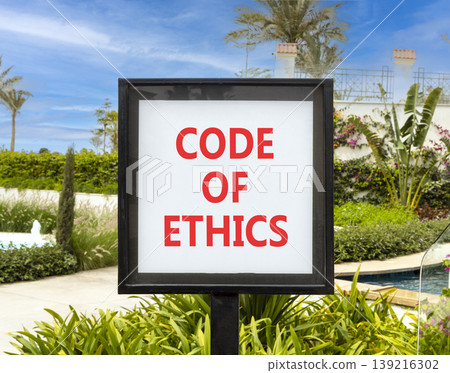 Code of ethics words symbol. Concept words Code of ethics on beautiful white sign. Beautiful hotel garden blue sky background. Business Code of ethics concept. Copy space. Code of ethics words symbol. Concept words Code of ethics on beautiful white sign. Beautiful hotel garden blue sky background. Business Code of ethics concept. Copy space. 139216302
