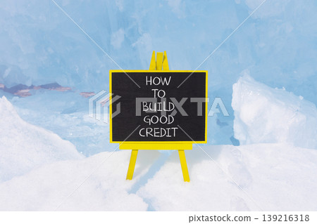 How to build good credit symbol. Concept words How to build good credit on beautiful black blackboard. Beautiful blue ice background. Business how to build good credit concept. Copy space. How to build good credit symbol. Concept words How to build good credit on beautiful black blackboard. Beautiful blue ice background. Business how to build good credit concept. Copy space. 139216318