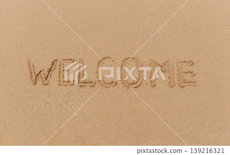 Business hello and welcome concept. Concept word Welcome written on beautiful ocean sea sand beach. Beautiful ocean sand beach background, copy space. Business hello and welcome concept. Business hello and welcome concept. Concept word Welcome written on beautiful ocean sea sand beach. Beautiful ocean sand beach background, copy space. Business hello and welcome concept. 139216321