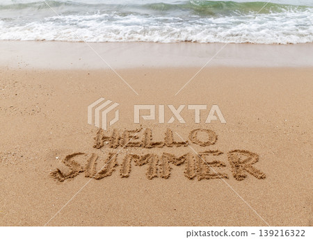 Hello summer words concept. Concept word Hello summer written on beautiful Red sea sand beach. Beautiful Red sea ocean sand beach background, copy space. Business travel Hello summer concept. Hello summer words concept. Concept word Hello summer written on beautiful Red sea sand beach. Beautiful Red sea ocean sand beach background, copy space. Business travel Hello summer concept. 139216322