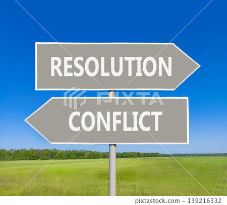Resolution and conflict symbol. Concept words Resolution and Conflict on beautiful grey road sign. Beautiful blue sky green grass background. Social resolution instead conflict concept. Copy space. Resolution and conflict symbol. Concept words Resolution and Conflict on beautiful grey road sign. Beautiful blue sky green grass background. Social resolution instead conflict concept. Copy space. 139216332