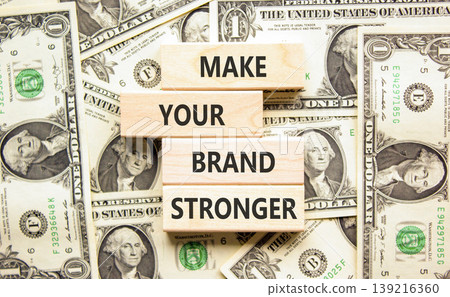 Make your brand stronger words symbol. Concept words Make your brand stronger on beautiful wooden blocks. Beautiful dollar bills background. Business make your brand stronger concept. Copy space. Make your brand stronger words symbol. Concept words Make your brand stronger on beautiful wooden blocks. Beautiful dollar bills background. Business make your brand stronger concept. Copy space. 139216360