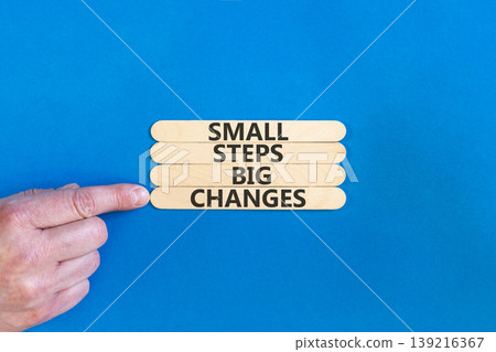 Small steps big changes words symbol. Concept words Small steps big changes on beautiful wooden sticks. Beautiful blue background. Business motivational small steps big changes concept. Copy space. Small steps big changes words symbol. Concept words Small steps big changes on beautiful wooden sticks. Beautiful blue background. Business motivational small steps big changes concept. Copy space. 139216367