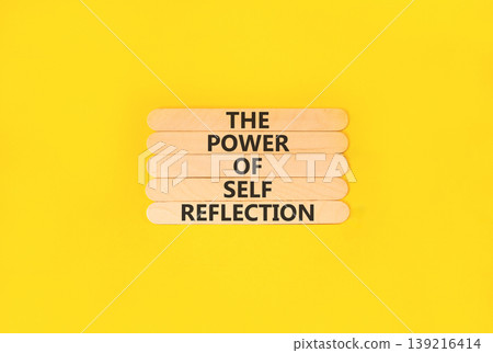 Self reflection symbol. Concept words The power of self reflection on beautiful wooden sticks. Beautiful yellow paper background. Business the power of self reflection concept. Copy space. Self reflection symbol. Concept words The power of self reflection on beautiful wooden sticks. Beautiful yellow paper background. Business the power of self reflection concept. Copy space. 139216414